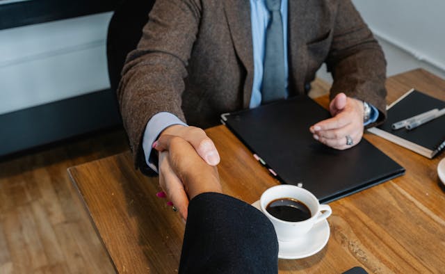 handshake%20over%20coffee